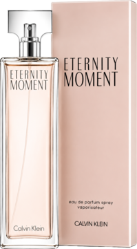 Eternity Moment Calvin Klein, kwiatowa woda perfumowana damska. Butelka obok różowego pudełka, widok z przodu.