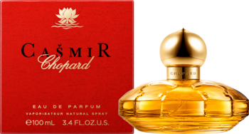 Chopard Casmir, orientalno-waniliowa woda perfumowana 100ml. Złota butelka z karbowaniami obok czerwonego pudełka.