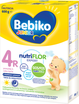 Żółte opakowanie Bebiko Junior 4R NUTRIflor Expert z kleikiem ryżowym dla dzieci po 2. roku życia, z misiem.