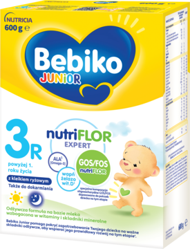 Bebiko Junior 3R mleko modyfikowane 600g z kleikiem ryżowym, żółto-białe opakowanie z misiem.