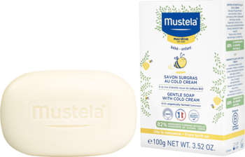 Mustela delikatne mydło z Cold Cream dla suchej skóry dzieci, kremowa kostka obok białego pudełka 100g.