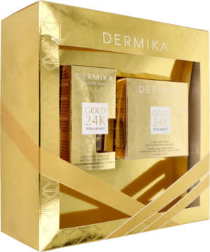Dermika Luxury Gold 24K Total Benefit, złoty zestaw do twarzy w otwartym eleganckim pudełku, widok z przodu.