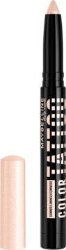 Jasny, beżowy Maybelline Color Tattoo 24H Eye Stix, cień do powiek w kredce, z odkręconą nasadką.