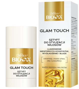 Biało-złoty sztyft do włosów Biovax Glam Touch z ceramidami i masłem shea, obok opakowania, widok z przodu.