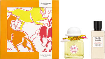 Zestaw Hermes Twilly d'Hermes: pomarańczowe pudełko z rysunkiem koni i dwa flakony perfum, jeden z białą wstążką.