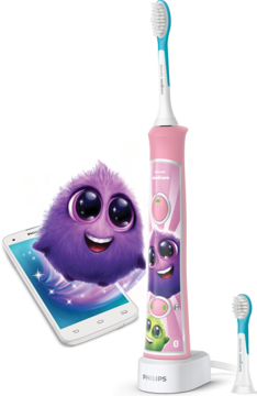 Różowa szczoteczka Philips Sonicare For Kids z naklejkami potworków i smartfonem z interaktywną aplikacją.