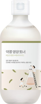 Tonik Round Lab Soybean Nourishing z ceramidami, biała butelka z zieloną etykietą i ilustracjami soi, widok z przodu.