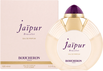 Boucheron Jaipur Bracelet, kremowa butelka wody perfumowanej z płaskim kształtem i fioletowym korkiem, obok pudełka.