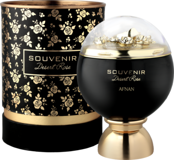 Souvenir Desert Rose Afnan woda perfumowana. Czarny, kulisty flakon ze złotymi detalami obok pudełka w róże.