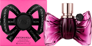 Viktor & Rolf Bonbon EDP w różowym pudełku i butelka w kształcie fuksjowej kokardy na białym tle.