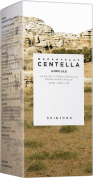 Białe opakowanie Skin1004 Madagascar Centella Ampoule, lekko pod kątem, z grafiką skalistego krajobrazu.