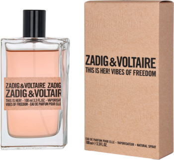 Perfumy Zadig & Voltaire This is Her! Vibes of Freedom, szklany flakon z różowym płynem obok kartonowego pudełka.