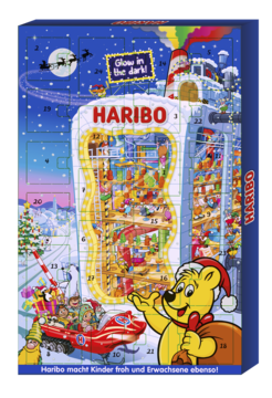 Haribo świecący w ciemności kalendarz adwentowy z żelkami, z Misiem Haribo, fabryką i zimową scenerią. Widok z przodu.