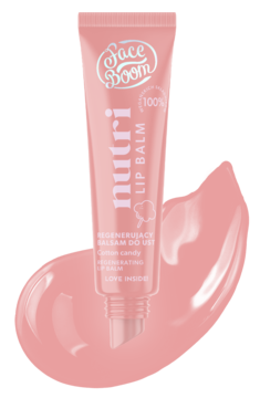 Różowy balsam do ust FaceBoom Nutri Cotton Candy, tubka z przodu na tle różowej smugi produktu.