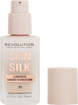 Blady różowy podkład serum Revolution Skin Silk F3 w butelce z pompką, obok leży nakrętka.