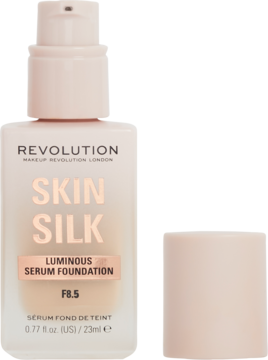 Jasny podkład Revolution Skin Silk F8.5 w szklanej butelce z pompką, zakrętka obok. Widok z przodu.