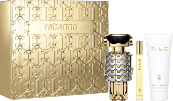 Zestaw perfum Fame Paco Rabanne: złote pudełko, butelka w kształcie robota, atomizer i balsam.