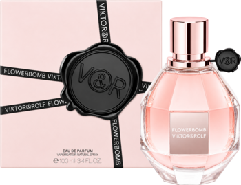 Perfumy Flowerbomb Viktor&Rolf, różowy flakon w kształcie granatu obok pudrowego opakowania z czarną pieczęcią.