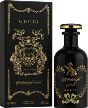 Flakon Gucci A Midnight Stroll EDP, czarny ze złotymi detalami i motywem wieńca, stojący obok eleganckiego pudełka.