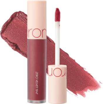 Rom&nd Zero Velvet Tint Burny Nude, matowa pomadka w płynie, widoczne otwarte i zamknięte opakowanie z aplikatorem oraz smugi.