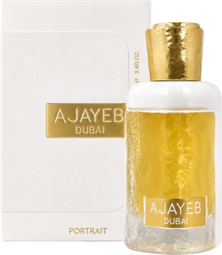 Ajayeb Dubai Portrait, perfumy w przezroczystej butelce ze złotym płynem, złotym korkiem, obok białego pudełka.
