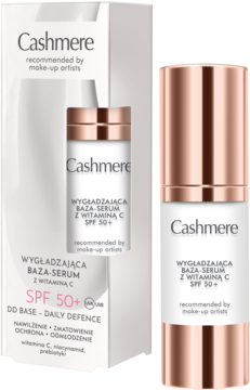 Baza-serum Cashmere SPF 50+ z witaminą C w białej butelce z rose gold, widok z przodu obok opakowania.