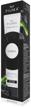 Piuma Visible Active Carbon Toothpaste w czarnej tubce i pudełku, z zielonym bambusem, widok z przodu.