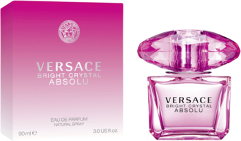 Różowy flakon Versace Bright Crystal Absolu z fasetowanym korkiem i biało-różowe pudełko obok.