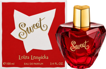 Lolita Lempicka Sweet eau de parfum: czerwony, fasetowany flakon w kształcie serca i białe pudełko w tle.