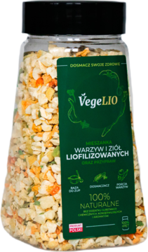 Butelka VegeLIO z liofilizowaną mieszanką warzyw i ziół, zielona etykieta, widoczne kolorowe kawałki, widok z przodu.