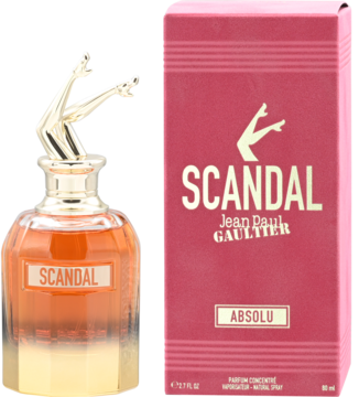 Flakon perfum Scandal Jean Paul Gaultier Absolu z bursztynowym płynem i złotą nakrętką w kształcie nóg, obok różowe pudełko.