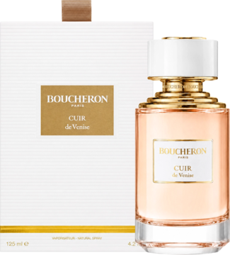 Boucheron Cuir De Venise woda perfumowana unisex, butelka z pomarańczowym płynem, obok białe pudełko ze złotym logo.