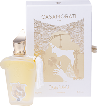 Elegancka butelka perfum Casamorati Dama Bianca z białym frędzlem i zdobionym pudełkiem, widok z przodu.
