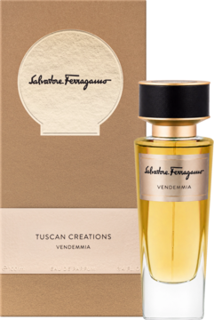 Woda perfumowana Salvatore Ferragamo Tuscan Creations Vendemmia w złotym flakonie obok brązowego pudełka.