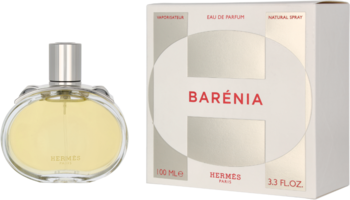 Hermes Barénia Eau de Parfum: złocista butelka z srebrnym korkiem obok białego kartonowego opakowania.