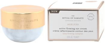 Ujędrniający krem pod oczy Rituals The Ritual Of Namaste Ageless w białym słoiku ze złotą nakrętką i pudełkiem, widok z przodu.