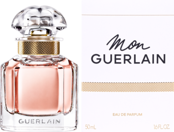 Guerlain Mon Guerlain EDP, butelka z jasnoróżowym płynem i fasetowanym korkiem obok białego pudełka, przód.
