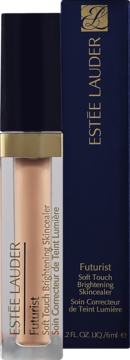 Estée Lauder Futurist Skincealer w jasnobeżowej tubce z czarną nakrętką, widok z przodu, obok ciemnoniebieskie pudełko.