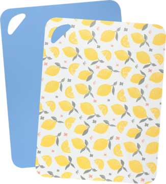 Zestaw 2 desek do krojenia: biała z wzorem w żółte cytryny i niebieska, ułożone pod lekkim kątem.