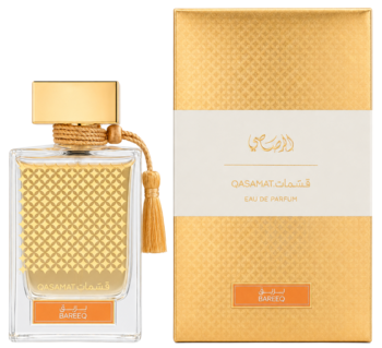 Rasasi Qasamat Barreq, orientalna woda perfumowana unisex. Złota butelka z frędzlem i pasujące, wzorzyste pudełko.