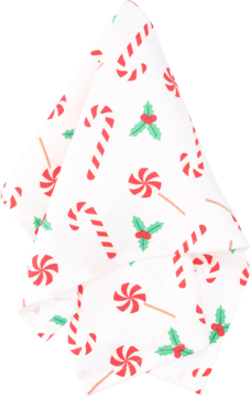 Świąteczna serwetka bawełniana w białe i czerwone wzory z cukierkami, lizakami i ostrokrzewem, złożona.