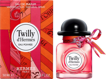 Twilly d'Hermès Eau Poivrée, różowa woda perfumowana 50ml z czarnym korkiem i kolorową wstążką obok pomarańczowego pudełka.
