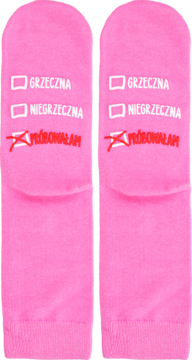 Różowe skarpetki z humorystyczną listą wyboru: GRZECZNA, NIEGRZECZNA, z zaznaczoną 'PRÓBOWAŁAM'.