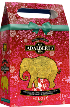 Czerwono-różowa herbata Sir Adalbert's Miłość w świątecznej torebce ze złotym słoniem i zieloną wstążką.