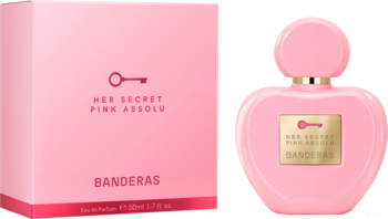 Perfumy Banderas Her Secret Pink Absolu w sercowatej, różowej butelce obok pasującego pudełka.