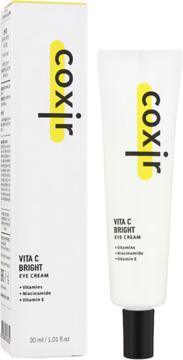 Coxir Vita C Bright Eye Cream: biała tubka i pudełko z żółtym logo, widok z przodu na białym tle.