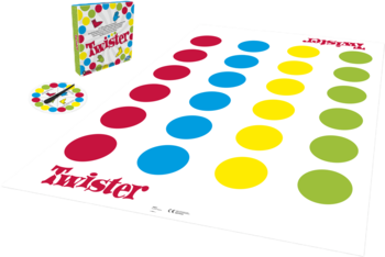 Gra Twister: rozłożona biała mata z rzędami czerwonych, niebieskich, żółtych i zielonych kół. Obok pudełko i spinner.