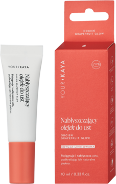 Tubka Nabłyszczającego olejku do ust Your Kaya Grapefruit Glow w białym opakowaniu z różową nakrętką, obok pudełka.