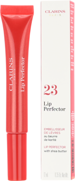 Clarins Lip Perfector nr 23 w czerwonej tubce obok białego opakowania, widok z przodu. Błyszczyk z masłem shea.