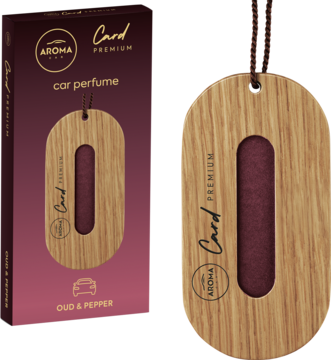 Drewniana zawieszka zapachowa Aroma Card Premium Oud & Pepper, owalna z czerwoną wstawką, obok bordowe opakowanie.